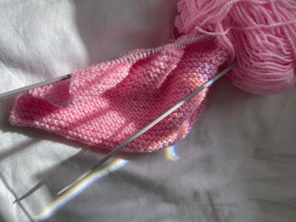 Knitting a pink scarf